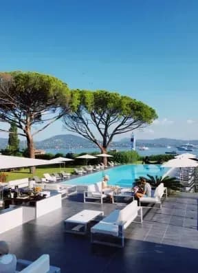 Resort pool area equipped with hospitality IPTV entertainment screens offering smart content customization
